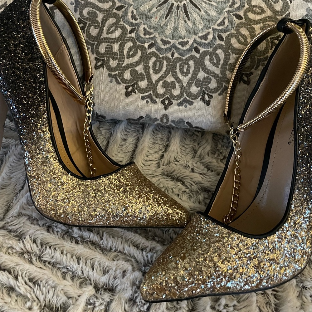 ShoeDazzle black and gold sparkle heels.